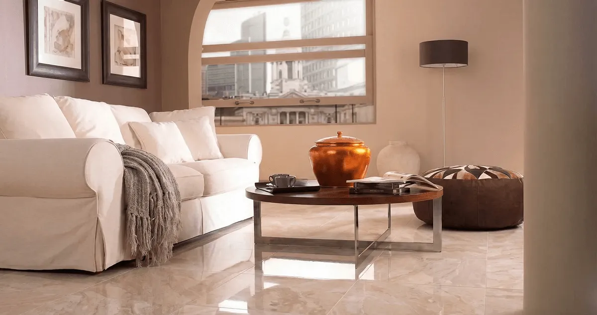 Modern living room with professionally installed marble flooring, a beige sofa, coffee table in Chula Vista, CA